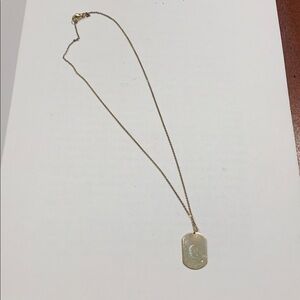 Gold tone mini dog tag pendant w crystal on 16” gold tone necklace